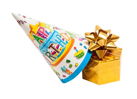 Brightly colored party hat with gift box isolated on the white backgroundの写真素材