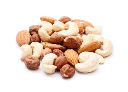Pile of mixed nuts isolated on the white backgroundの写真素材