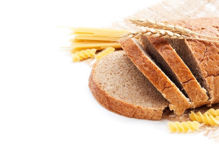 Fresh bread with wheat spikes and macaroni over whiteの写真素材