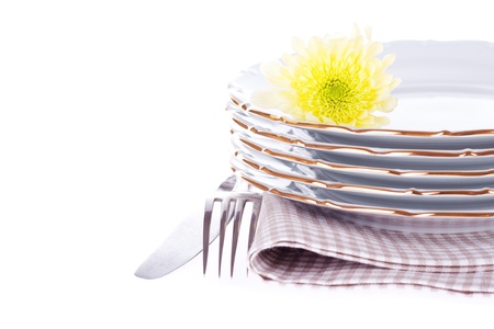 Set of dish, fork, knife, napkin and flower on the white  With sample textの写真素材