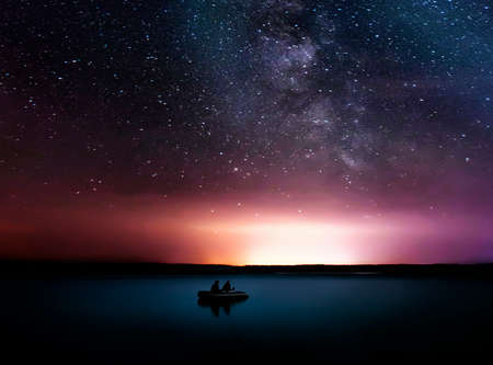 Picturesque View Of The Lake On The Background Of The Night Sky, the boat sails under the starry...