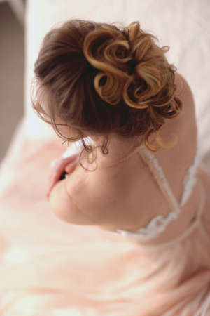 Sensual photo, a beautiful girl in a transparent dress in pastel colors. Out of focus art photo with shallow depth of field. The romantic style of impressionism. Ballerina is resting, top view.の写真素材