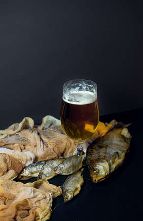 Dried and Dried Taranki, Delicious Fish-Clip on a dark Background. A Popular Beer Snack....