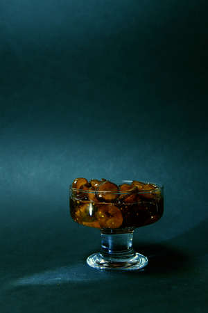 dessert on a dark background in a stylish design. the play of chiaroscuro gives a mysterious charm and mood. advertising of premium-class restaurants. innovative products and services.の写真素材