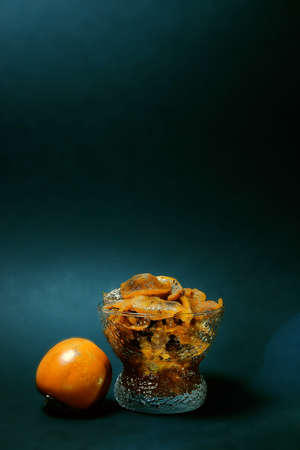 dessert on a dark background with juicy fruit. the play of chiaroscuro gives a mysterious charm and mood. advertising of premium-class confectionery. innovative products and services. author's recipesの写真素材