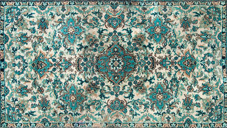The texture of a Persian carpet, an abstract ornament. Round Mandala Pattern, Traditional Middle Eastern Carpet Fabric Texture. Turquoise milky green beige, light green, brown. vintage, oriental motifsの写真素材