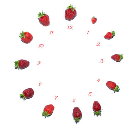 proper nutrition, the concept of a diet. vegetarianism. Berries laid out on a white background in the form of a dial. empty space. soft focus. the concept of time and seasonality of products.の写真素材