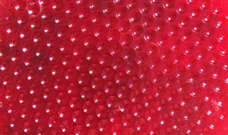 a modern rich abstract red background, the structure of berry marmalade with highlights and artistic...