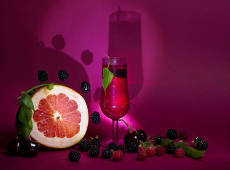 a glass of wine, a still life of fruit, a conceptual photoの写真素材