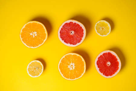 fruits on a bright yellow background. healthy lifestyle. copy space. a screensaver for the site, advertising. commercial offer. diversity of genders and nationalities in the world. conceptual.の写真素材