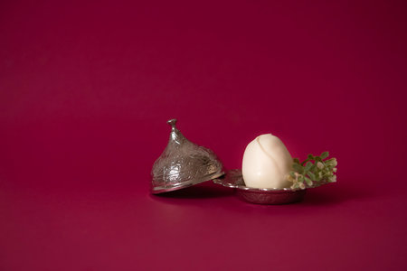 Easter Cake in the shape of an Egg,made from sponge crumbs mixed with cream,filling with mousse cream,the cake itself is covered with White Chocolate.A great Alternative to Baking Easter Cakesの写真素材