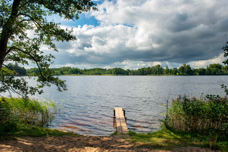 Panoramic view of a beautiful forest lake. The concept of a good holiday and fishing. The connection of man with nature,restoration of strength. Rest and recovery after stress and depression.fresh airの写真素材