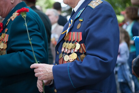 UKRAINE, KIEV, MAY 9, 2016, Victory Day, May 9. Monument to an unknown soldier: Veterans of World War II carry flowers to the monument of an unknown soldierのeditorial素材