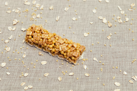 Cereal bars of granola with apples, nuts and honey. Fitness bar, cereal, wallpaper, background.の写真素材