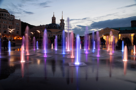 Water fountain, glows in many colors.Water, colorful fountain, evening.の写真素材