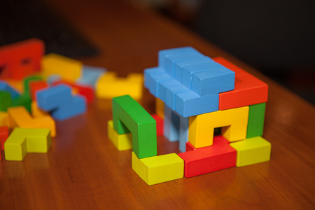 Wooden multicolored designer on the table. Wooden toy blocks, designer.の写真素材