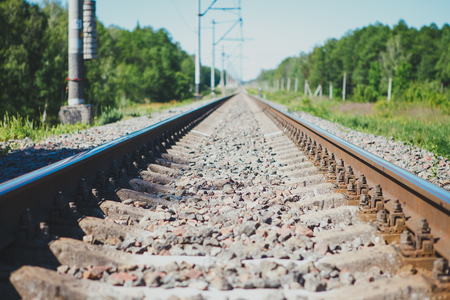 Railway track to the up country. Railway rail close-up, background, wallpaper.の写真素材
