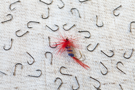 Fishing lure, hook. Fishing hooks on a gray background, wallpaper.の写真素材