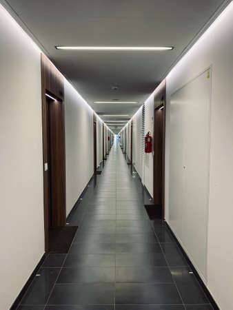 Hotel corridor with doors. Interior background