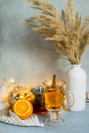 Still-life. A teapot and a cup of tea on the coffee table. A cozy autumn conceptの写真素材