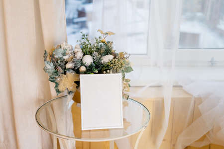 Christmas photo frame mock up template with decoration on wooden table.の写真素材