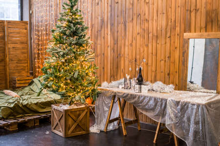 Christmas living room interior designtree decorated lights garland lighting holiday., dinner set table glasses decorの写真素材