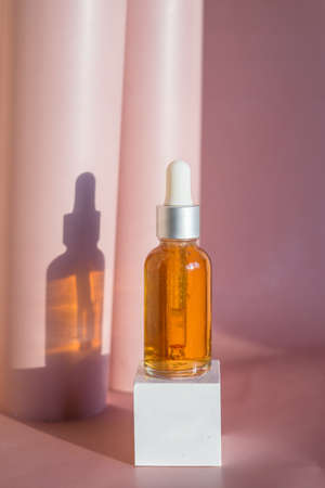 Natural essential oil or serum in brown glass bottle. Alternative medicine, beauty skin care productの写真素材