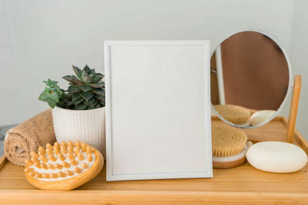 Mock up photo frame, elegant accessories and beautiful plants in different pots.の写真素材