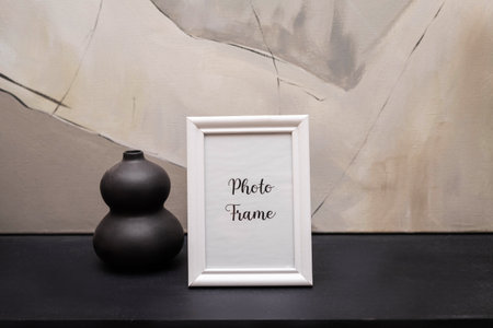 Portrait white picture frame mockup with christmas gifts, boken lightsの写真素材