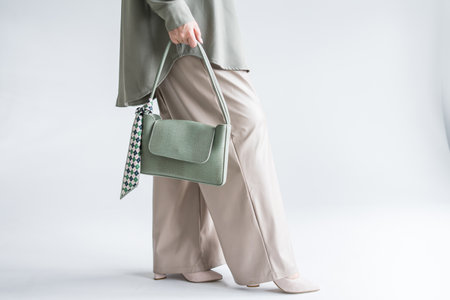 Woman holding shopping bags, text black friday, on gray backgroundの写真素材