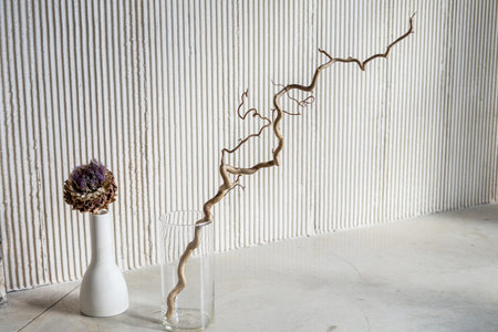 Abstract nature scene with composition of stones and dry branch.Neutral beige backgroundの写真素材