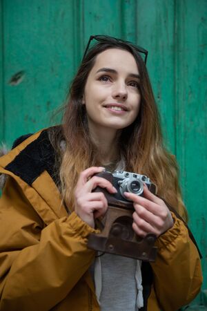 Photo of young tourist girl exploring streets of Baku. Moody photos of teenager girl visiting old city and taking photos of the city.の写真素材