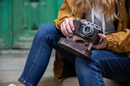 Photo of young tourist girl exploring streets of Baku. Moody photos of teenager girl visiting old city and taking photos of the city.の写真素材