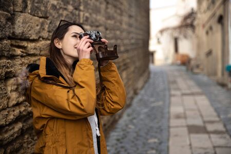Photo of young tourist girl exploring streets of Baku. Moody photos of teenager girl visiting old...