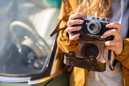 Photo of young tourist girl exploring streets of Baku. Moody photos of teenager girl visiting old city and taking photos of the cityの写真素材