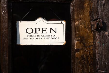 Welcome Sign plate with text There is always a way to open any door hanging on the glass door.の写真素材