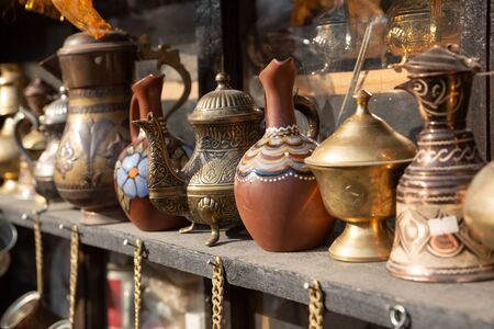 Bronze and copper handcrafted cookware in street shop. Shaki, Azerbaijan.の写真素材