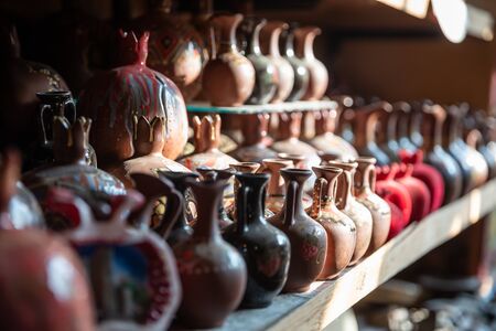 Bronze and copper handcrafted cookware in street shop. Shaki, Azerbaijan.の写真素材
