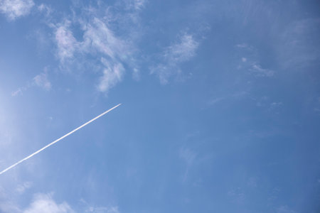 trace of the plane in blue sky.