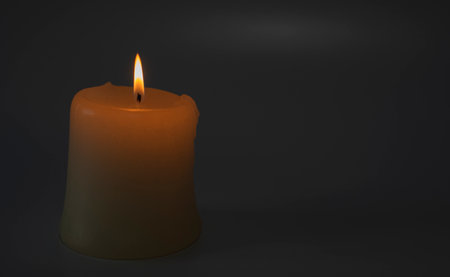Burning candle on a black background.Copy space.の写真素材