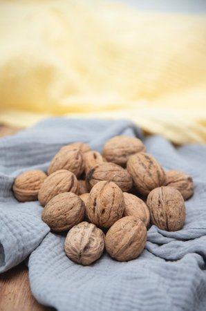Food background. Walnut kernels close-up. Chopped nuts lie on a table.
