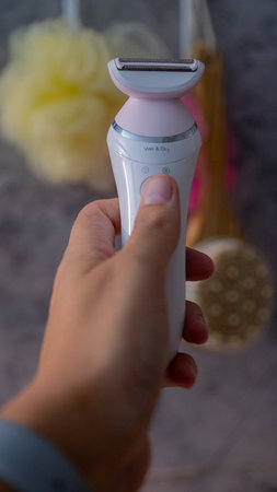 Woman Epilation, Hair Removal, Skin Care and Health. White Epilator.