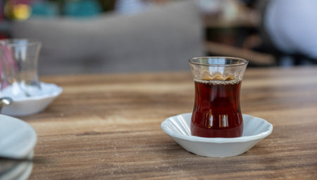 Glass of Turkish tea on the table in a classic glass and saucerの写真素材