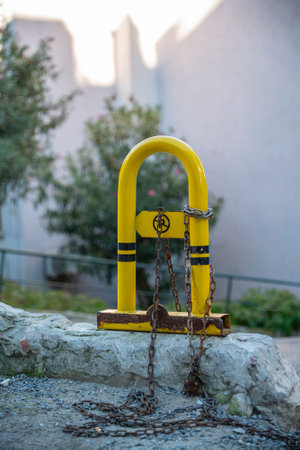 Yellow iron fence in the street.