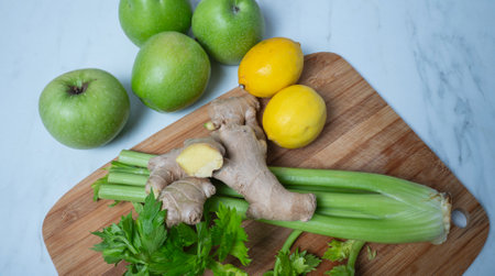 Green apple ginger lemon and celery stalks. detox concept and healthy food.