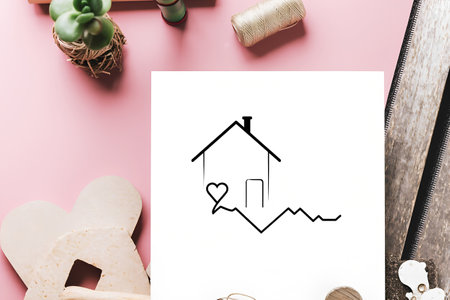 Simple icon of house inside heart shape.の素材