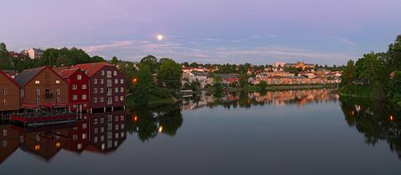 Panoramic view of Nidelva River from Old Town bridge at summer night. Trondheim. Norwayの写真素材