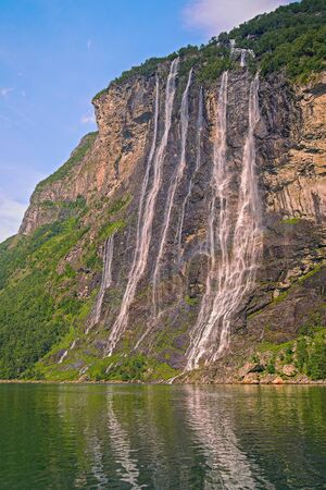 View of the beautiful Seven Sisters Waterfall from the Geiranger Fjord. Norwayの写真素材