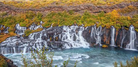 Panoramic view of the Hraunfossar waterfall in early autumn. Icelandの写真素材
