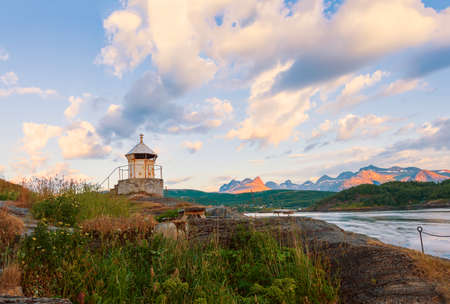 Old lighthouse on the shore of the Saltstraumen straitat sunset. Bodo municipality Nordland county. Norwayの写真素材